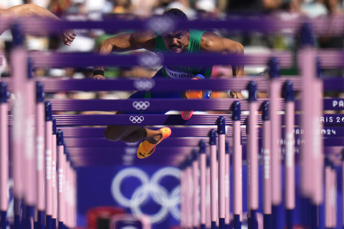 Rafael Pereira of Brazil competes in a men's 110-meters hurdles repechage at the 2024 Summer Olympics, Tuesday, Aug. 6, 2024, in Saint-Denis, France. (AP Photo/Petr David Josek)